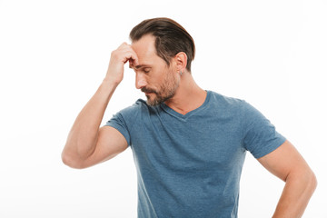 Naklejka premium Portrait of a pensive mature man dressed in t-shirt