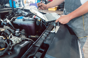 Close-up of a screwdriver held by a skilled mechanic