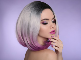 Ombre bob short hairstyle. Beautiful hair coloring woman. Trendy haircuts. Purple Manicured nails. Blond model with short shiny hairstyle. Concept Coloring Hair.