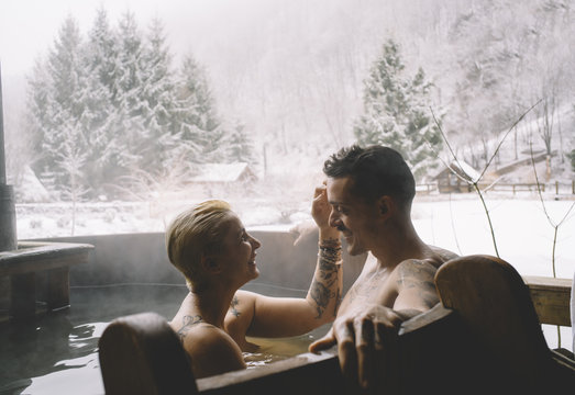 Couple sitting in plunge tub