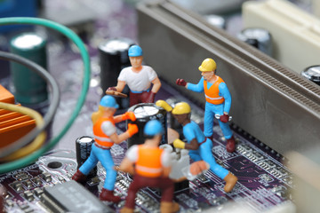 Selective focus of miniature engineer and worker fixed chip and  mainboard computer and use for business background.