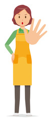 A middle-aged housewife wearing an apron is stop gesture