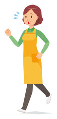 A middle-aged housewife wearing an apron is running