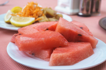 Watermelon cut and laid on a plate