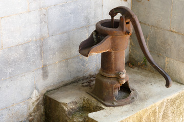 Ancient rusty pump for water supply