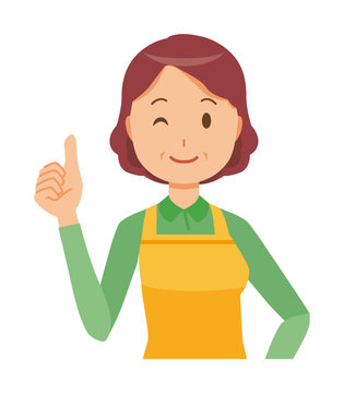 A middle-aged housewife wearing an apron is showing thumbs up