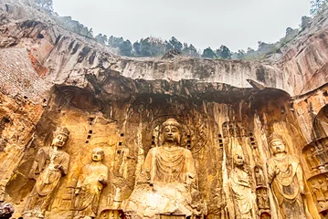 Fotobehang LUOYANG, CHINA - OCTOBER 28: Visitors at Longmen grottoes on October 28, 2007.It is one of the four notable grottoes in Luoyang,Henan,China . A UNESCO World Heritage Site. © warasit