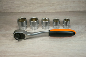 A set of new heads with ratchet wrenches for car repairs.