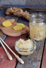 Pickled ginger slices and wooden chopsticks. Ingredient for sushi. Healthy food. Traditional Japanese condiment.