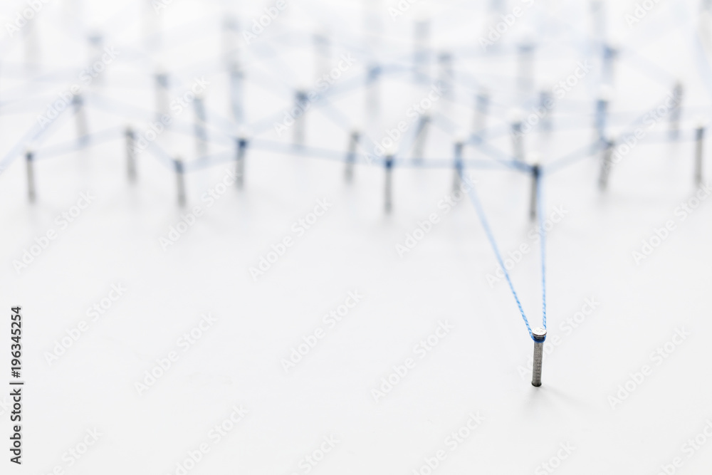 Poster a large grid of pins connected with string. communication, technology, network concept