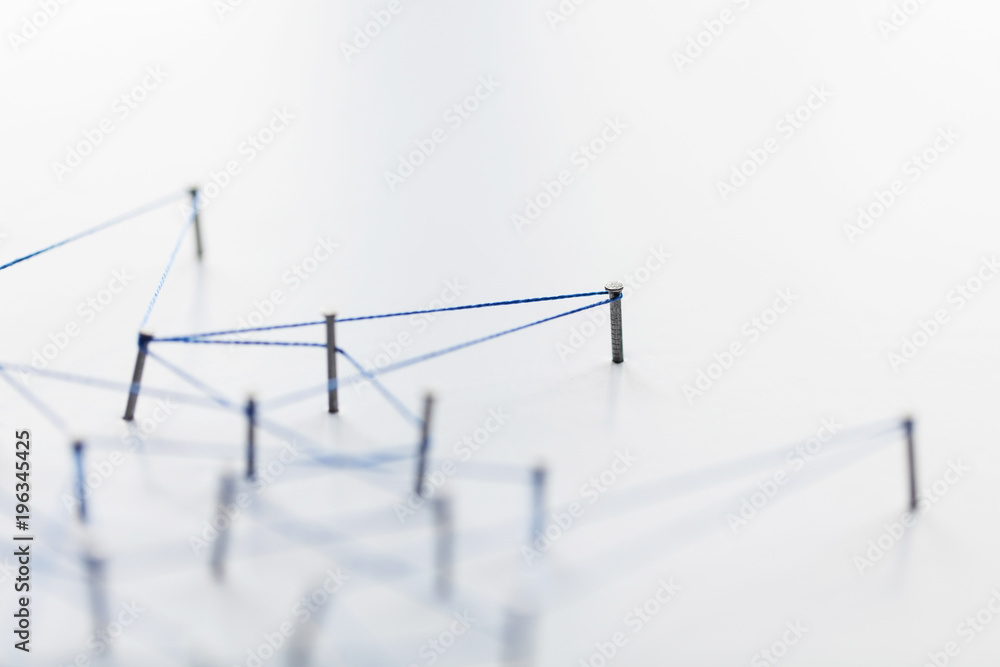 Poster a large grid of pins connected with string. communication, technology, network concept