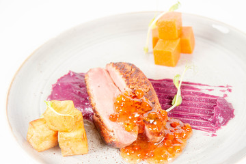 Roast duck breast, red cabbage with apple, roasted potatoes,mountain ash and honey sauce