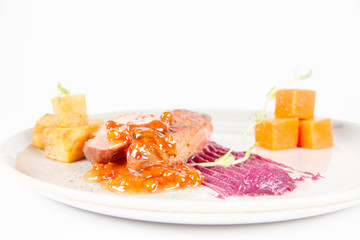 Roast duck breast, red cabbage with apple, roasted potatoes,mountain ash and honey sauce