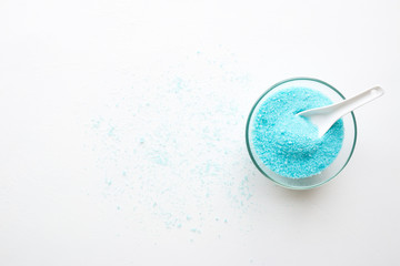 blue bath salt beauty treatment on white background