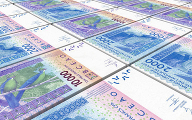 West African CFA francs bills stacked background. 3D illustration.