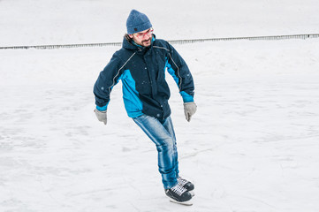 Ice skater at skating rink in motion © unclepodger