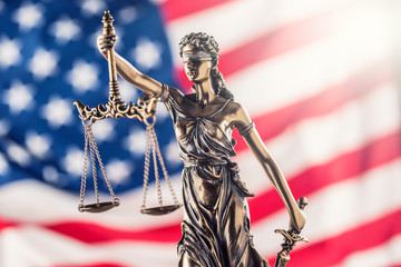 Lady Justice and American flag. Symbol of law and justice with USA Flag