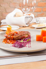 Roast duck breast, red cabbage with apple, roasted potatoes,mountain ash and honey sauce