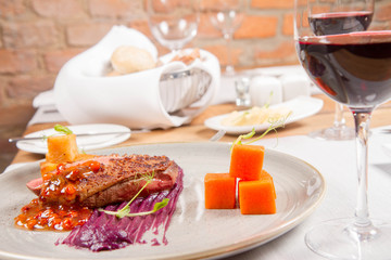 Roast duck breast, red cabbage with apple, roasted potatoes,mountain ash and honey sauce