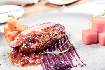 Roast duck breast, red cabbage with apple, roasted potatoes,mountain ash and honey sauce