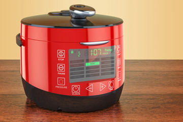 Red Automatic Multicooker on the wooden table. 3D rendering