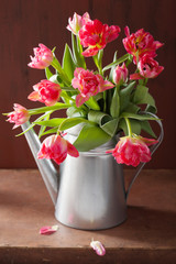 beautiful pink tulip flowers bouquet in watering can