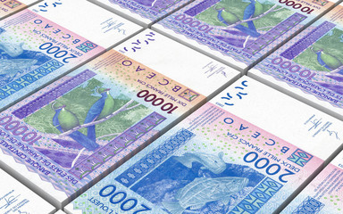 West African CFA francs bills stacked background. 3D illustration.