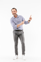 Fototapeta premium Happy handsome adult businessman pointing.