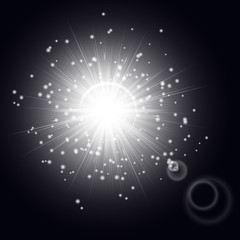 Silvery light effect with shining rays and bright particles of stellar dust on a black background