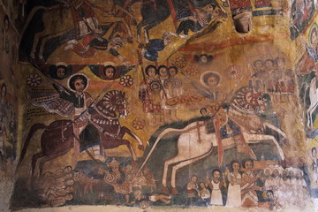 : iconographic scenes and wall murals of saints painted in naive african christian style in Abreha Atsbeha church 