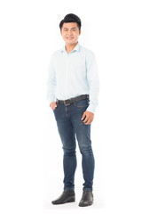 Portrait of confident Asian man wearing shirt and jeans posing on white background