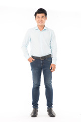 Portrait of confident Asian man wearing shirt and jeans posing on white background