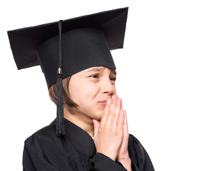 Portrait of graduate little girl student in black graduation gown with hat, close up - isolated on white background. Child back to school and educational concept.