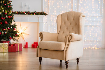 Christmas Tree and Christmas gift boxes in the interior with a fireplace.