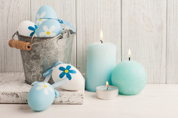 White blue easter eggs, candles