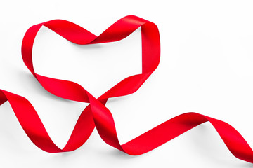 Red heart ribbon isolated on white background (clipping path), symbolic concept for National heart...