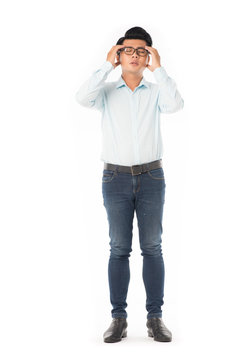 Full length portrait of young Asian man suffering from headache isolated on white