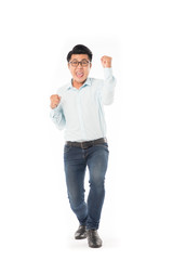 Portrait of ecstatic young man in eyeglasses celebrating success