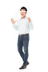 Portrait of young Asian man wearing 3d cinema glasses on white background