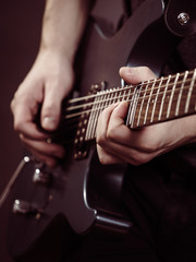 Fototapeta premium Male hands playing electric guitar