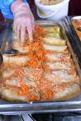 Hand of the woman preparing the street food in Kaunas, Lithuania