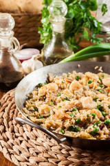 Fried rice with shrimp and vegetables on a frying pan