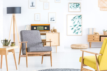 Grey wooden armchair in interior