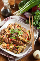 Fried rice with chicken and vegetables served on a plate