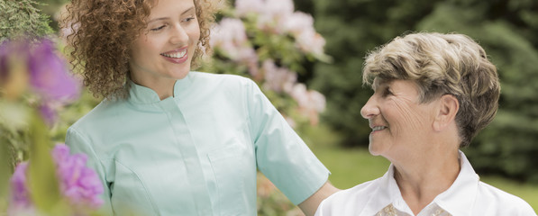 Strolling in the garden with her favourite nurse