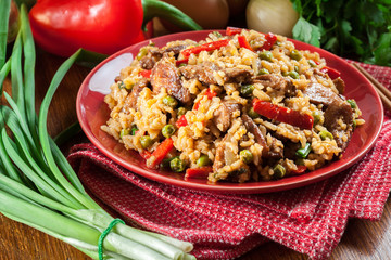 Fried rice with chicken and vegetables served on a plate