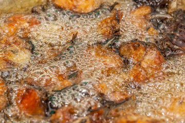 Obraz na płótnie Canvas Striped catfish fry oil in hot pan.selective focus.