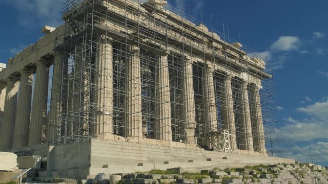 The Parthenon Under Construction. The Acropolis is one of the most important ancient monuments in the world with archaeological structures including: The Acropolis, Erechtheion, Parthenon, Propylaea.