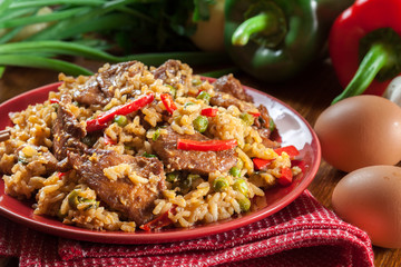Fried rice with chicken and vegetables served on a plate