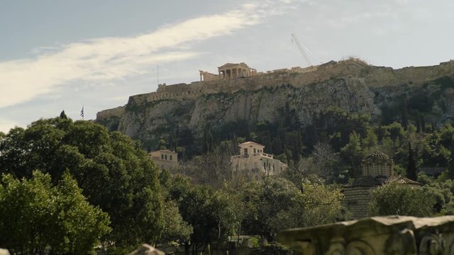 The Acropolis seen from the City Ruins. The Acropolis is one of the most important ancient monuments in the world with archaeological structures including: The Acropolis, Erechtheion, Parthenon.